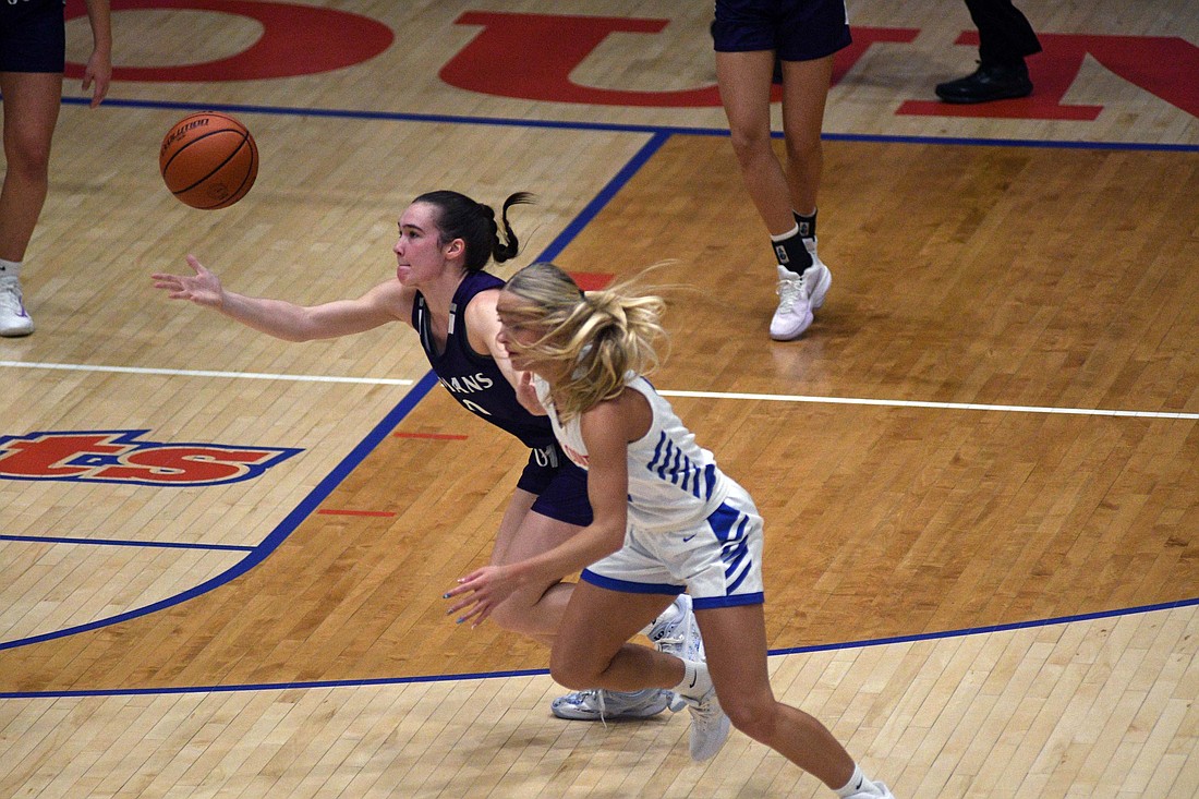 Cameron Muhlenkamp of the Fort Recovery High School girls basketball team fends off the Jay County Patriots’ Hallie Schwieterman to gain possession during the Indians’ 55-43 loss to the Patriots on Saturday. Muhlenkamp’s defense was vital in holding Hallie’s sister Karsyn to just four points on 1-for-11 shooting, but the elder Schwieterman picked up her sibling with a game-high 25 points, including 11 made free throws. Both teams return to action Thursday, with the Patriots taking on Bluffton at home and Fort Recovery traveling to Marion Local. (The Commercial Review/Ray Cooney)