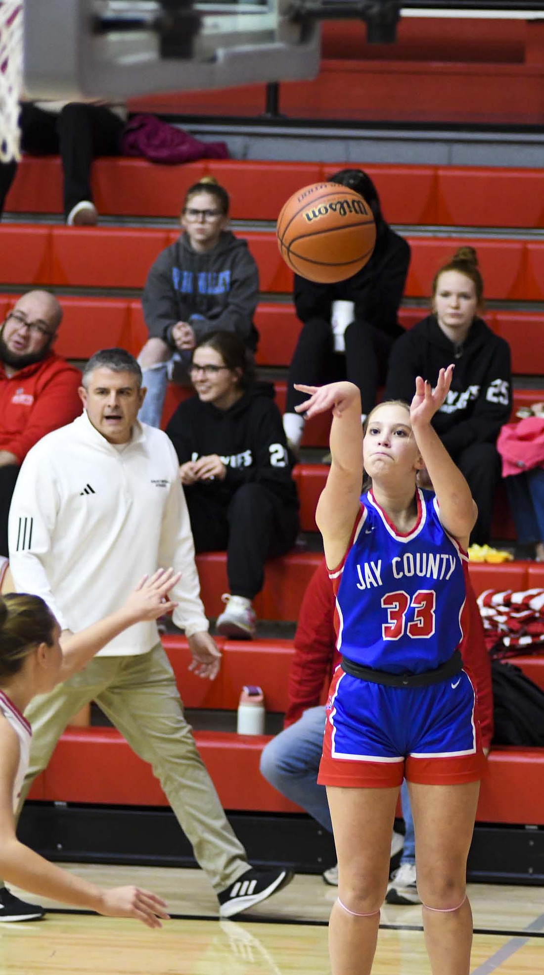 Ava May of the Jay County High School girls basketball team puts up a jumper from the short corner during the first half of the Patriots’ 50-45 victory over the Adams Central Jets on Friday. The comeback victory elevated the Patriots above .500 at 4-3 and got them off on the right foot in the Allen County Athletic Conference with a 1-0 start. JCHS will be back in action tonight when they host the Blackford Bruins. (The Commercial Review/Andrew Balko)