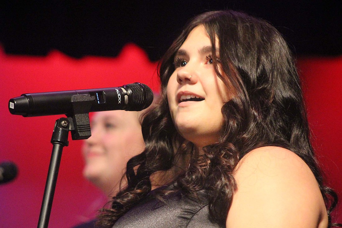 Ashlyn Cantu of the Fort Recovery High School choir sings during Sunday’s concert at the elementary/middle school auditeria. The performance included the songs “Yule Be Rockin” and “Christmas Dreams.” (The Commercial Review/Bailey Cline)