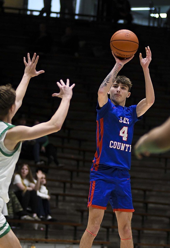 Jay County High School’s Jayden Comer fires up a 3-point shot during the first quarter of a 58-41 victory over New Castle on Monday. Comer hit four triples for 12 of the 22 first-quarter points en route to a game-high 21 points. (The Commercial Review/Andrew Balko)