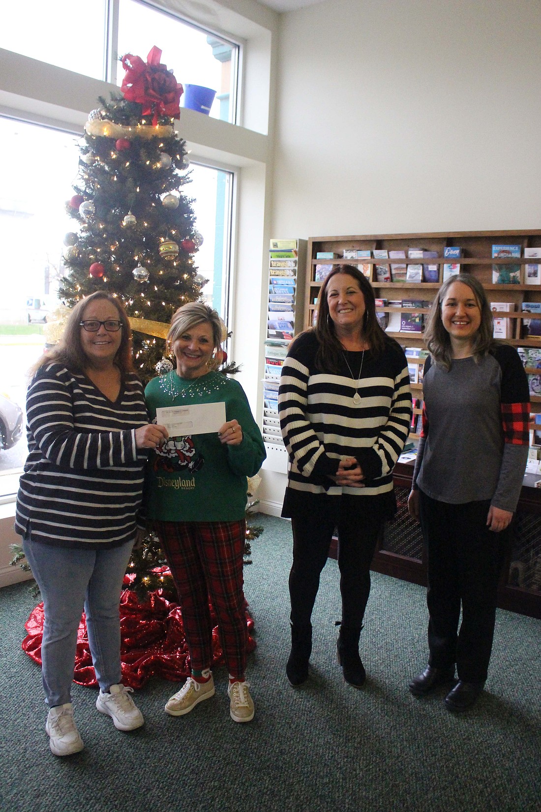 Jay County Chamber of Commerce announced Festival of Trees winners Thursday. Pictured above are first place winner Jay County Conservation Club with club caretaker Missie Pagel, Tami Vormohr, chamber director Amanda Nixon-Randall and Jay County Public Library children’s services librarian Shana Neuenschwander. (The Commercial Review/Bailey Cline)