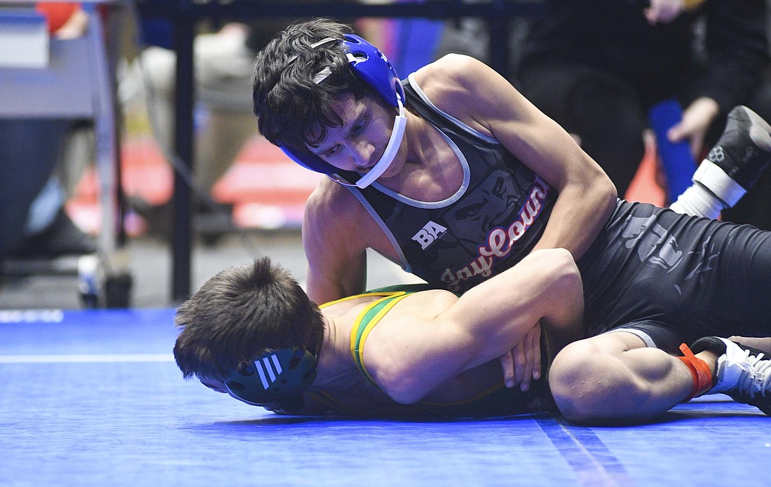 Corbin Lothridge of Jay County High School controls Northridge senior Adley Yder during their third-place match Tuesday in the East Central Indiana Classic. Lothridge, a sophomore, defeated Yoder 4-1 as the host Patriots finished in fourth place. The JCHS wrestlers are off until competing in the Battle at the Bear Den hosted by Monroe Central on Saturday, Jan. 3. (The Commercial Review/Ray Cooney)