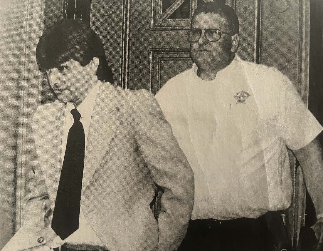 Jay County Sheriff Todd Penrod (right) escorts Tim McAbee out of Jay County Courthouse during his May 2000 murder trial. Bob Brumett and McAbee’s sentencings for murder and robbery were selected by The Commercial Review’s staff as one of the top 10 stories of the year. (The Commercial Review/Jennifer Dattoli)
