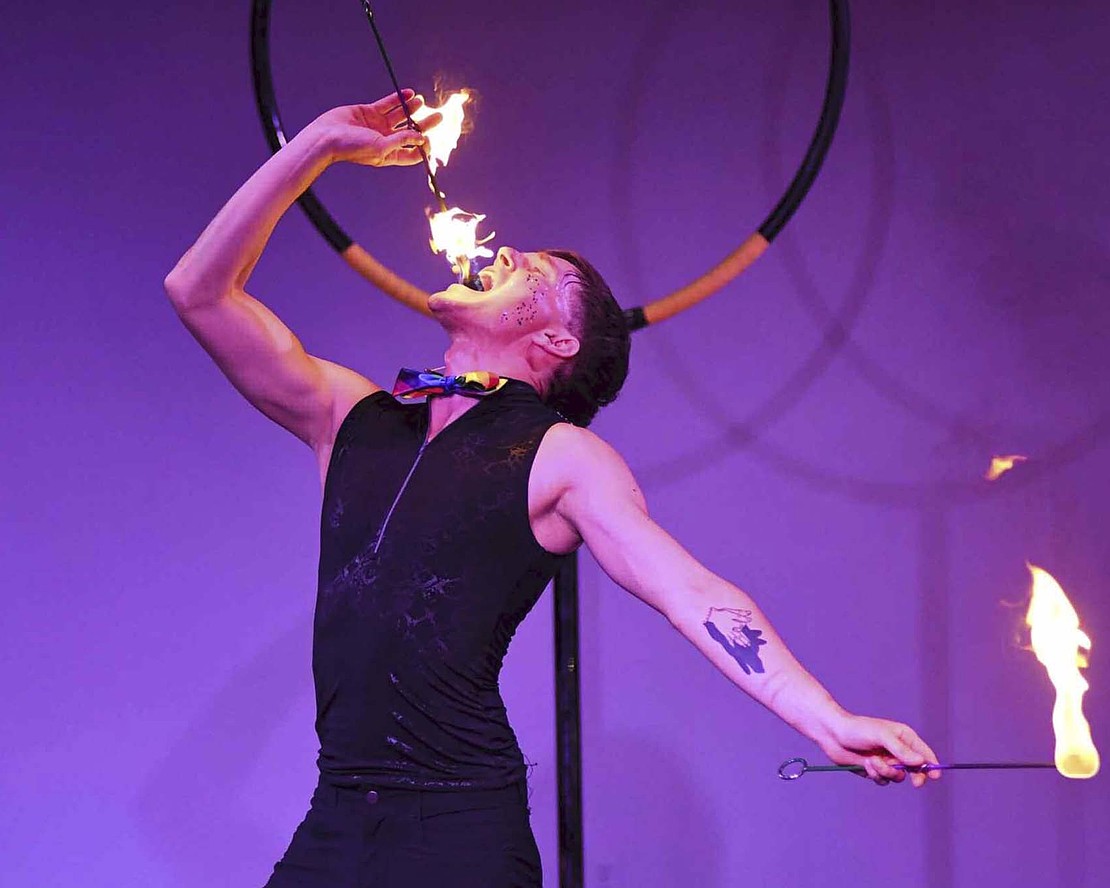 Chris Baker of Cincinnati Circus eats fire April 13 during a duo performance along with Lauren Ashley to close the 2025 Eric R. Rogers Performance Series at Arts Place in Portland. Baker and Ashley shared a variety of talents with the audience, including juggling, hula hooping and aerial tricks. (The Commercial Review/Ray Cooney)