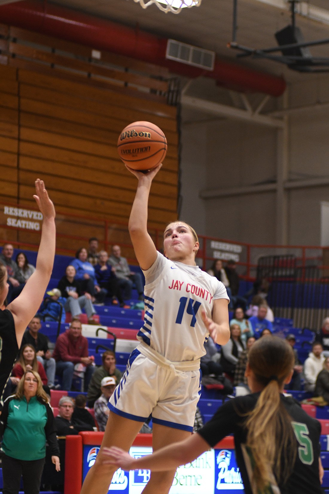 Elizabeth Brunswick of the Jay County High School girls basketball team lofts up a shot during the Patriots' 66-59 win over the Yorktown Tigers on Tuesday. Brunswick's 10 points included timely baskets such as a layup with 46 seconds to go to extend the Jay County lead to five.