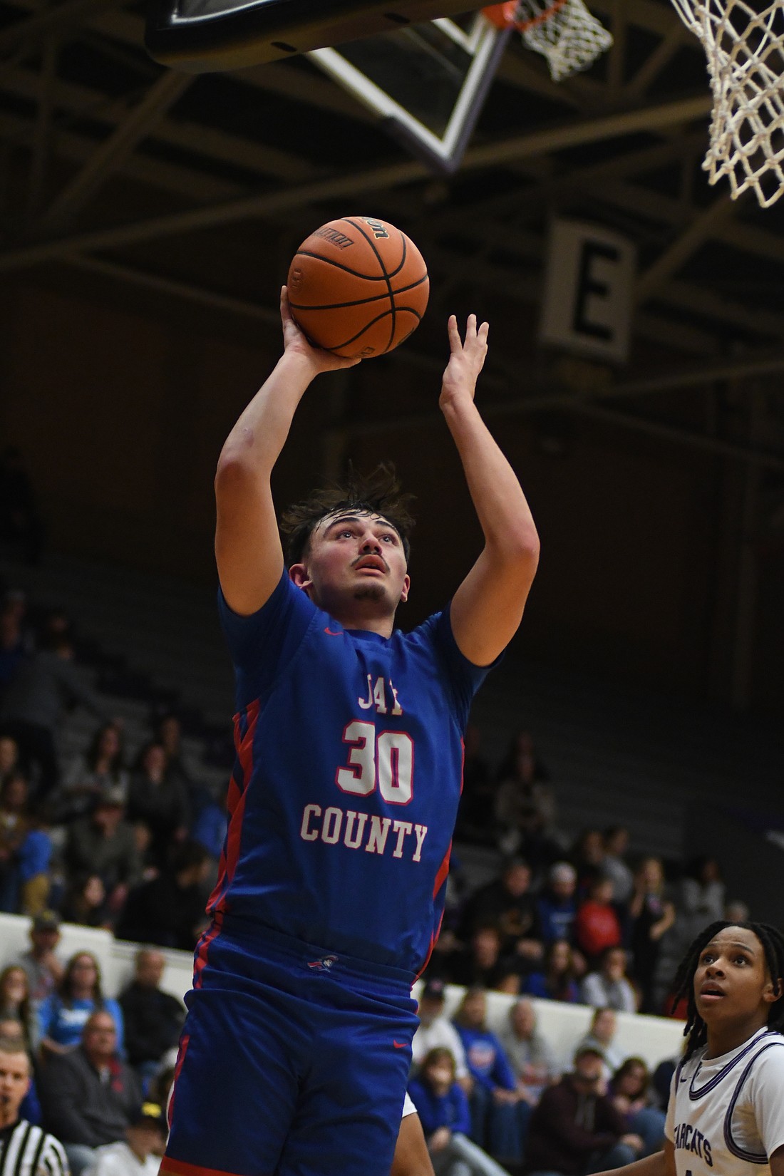 Aiden Phillips attempts a layup for the Patriots. (The Commercial Review/Andrew Balko)