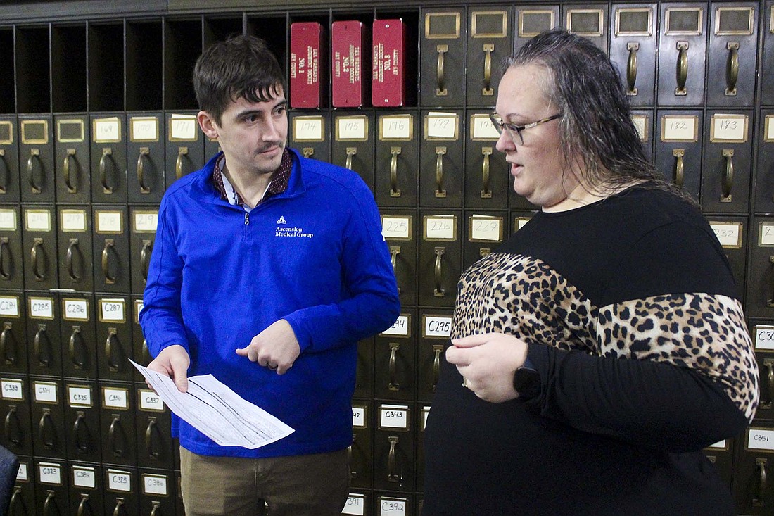 Jay County Commissioner candidate Aaron Loy consults with Jay County clerk Missy Elliott on Wednesday morning while going through the process to file to run for office. Bryan Alexander and Loy, both Republicans, filed Wednesday to run for the middle district commissioner seat. Incumbent Republican Chad Aker announced last month that he will not seek re-election. (The Commercial Review/Bailey Cline)