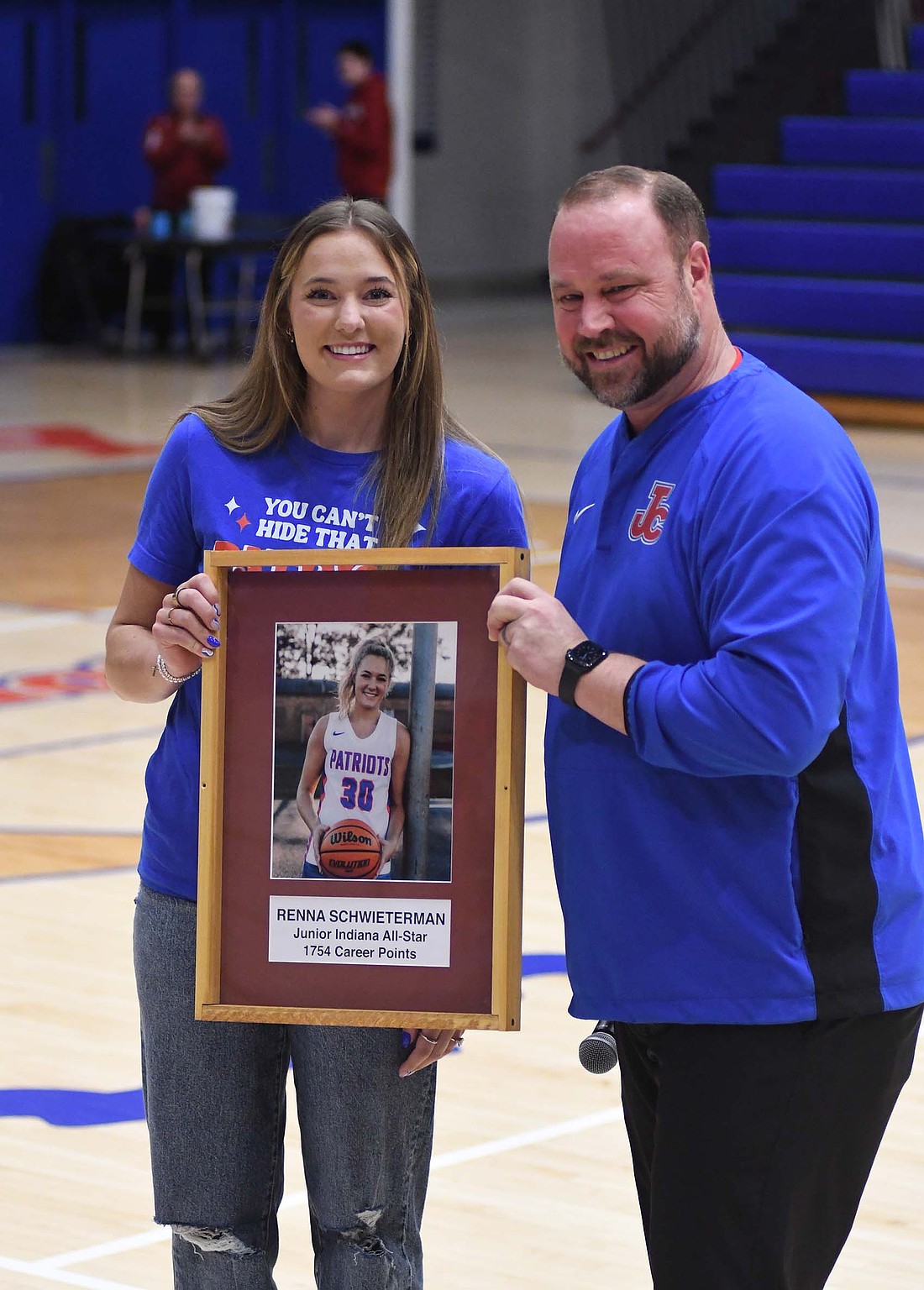 Jay County High School inducted 2023 graduate Renna Schwieterman to its Athletic Wall of Fame before Friday’s Patriot girls basketball game against the Bluffton Tigers. Schwieterman is Jay County’s all-time leading scorer for basketball with 1,754 career points. She was also a Junior Indiana All-Star. For more on the game, in which Renna’s sisters Hallie and Karsyn led the Patriots to an Allen County Athletic Conference victory, see page 10. (The Commercial Review/Andrew Balko)