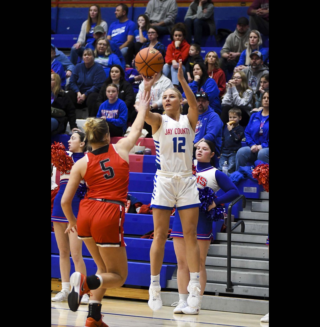 Jay County High School junior Hallie Schwieterman rises up to shoot a 3-pointer from the left corner during the Patriots 63-45 win over Bluffton on Friday. Schwieterman had 14 points, six rebounds, three assists and a block to help lift the Patriots over the Tigers. (The Commercial Review/Andrew Balko)