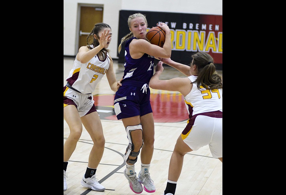 Makenna Huelskamp of the Fort Recovery High School girls basketball team comes to a jump stop between New Bremen’s Liviya Whitlatch (2) and Allie Bornhorst (34) during Thursday’s 38-28 loss. The Tribe led most of the game before a 14-0 run in the fourth quarter gave the Cardinals the edge. (The Commercial Review/Andrew Balko)