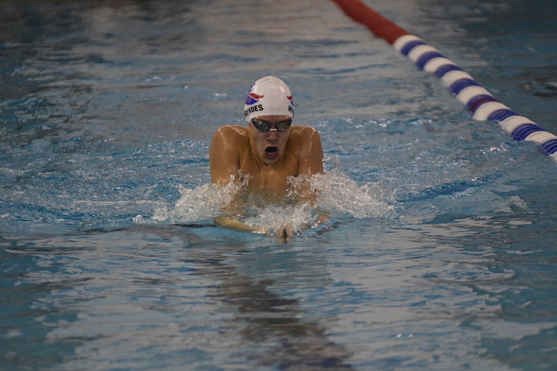 Carson Westgerdes of the Jay County High School swim team hoists himself out of the water during the breaststroke portion of his victory in the boys 200-yard individual medley at Tuesday's meet against the visiting Muncie Central Bearcats. Jay County bested the Bearcats 219-53 on the girls side but the boys fell 150-147. (The Commercial Review/Ethan Oskroba)