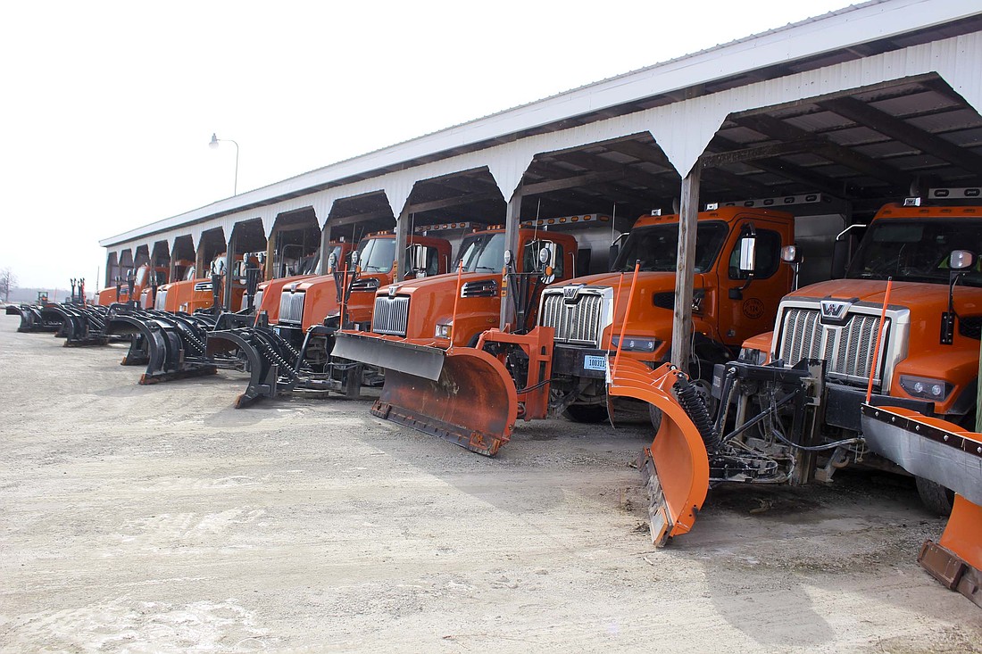 Plow trucks sit in line Friday at Jay County Highway Department. County employees prepared vehicles Thursday for extreme cold and snow this weekend. The forecast calls for 10 to 15 mph winds and snow starting to fall tonight, when the low may hit 8 degrees. Sunday’s low may dip to 2 degrees, with as much as 10 inches of snow possible. (The Commercial Review/Bailey Call)