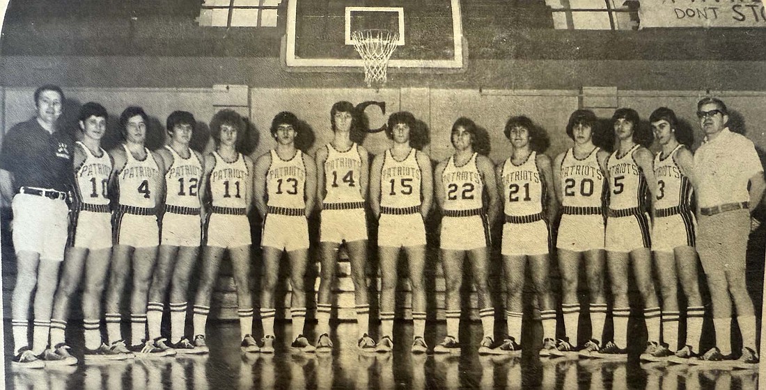 Pictured is the first Jay County High School boys basketball team from the 1975-76 season. From left are coach Bob Collins, Frank Laux, Cevin Collins, Randy Weisel, Dean Hunt, Kurt Keller, Tom Dunnington, Brian Grady, Frank Vormohr, Dave Hedges, Scott Smith, Mike Walters, Dean Theurer and assistant coach Don Alexander. JCHS will host members from the first team during Saturday’s game against Blackford to celebrate 50 years of Patriot athletics. (The Commercial Review)